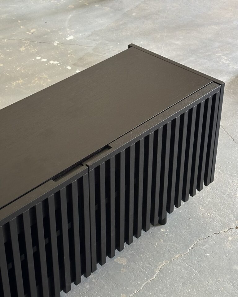 Black wooden cabinet with slatted design